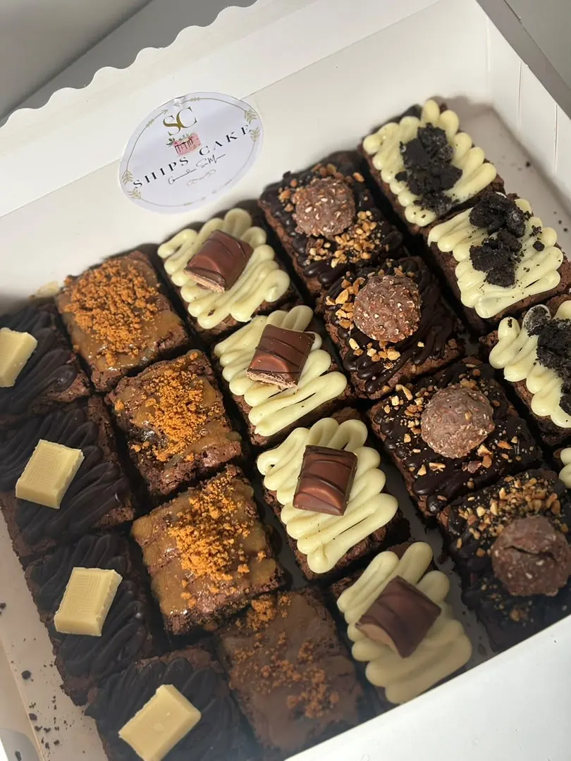 Tray of assorted brownies topped with white chocolate and hazelnut