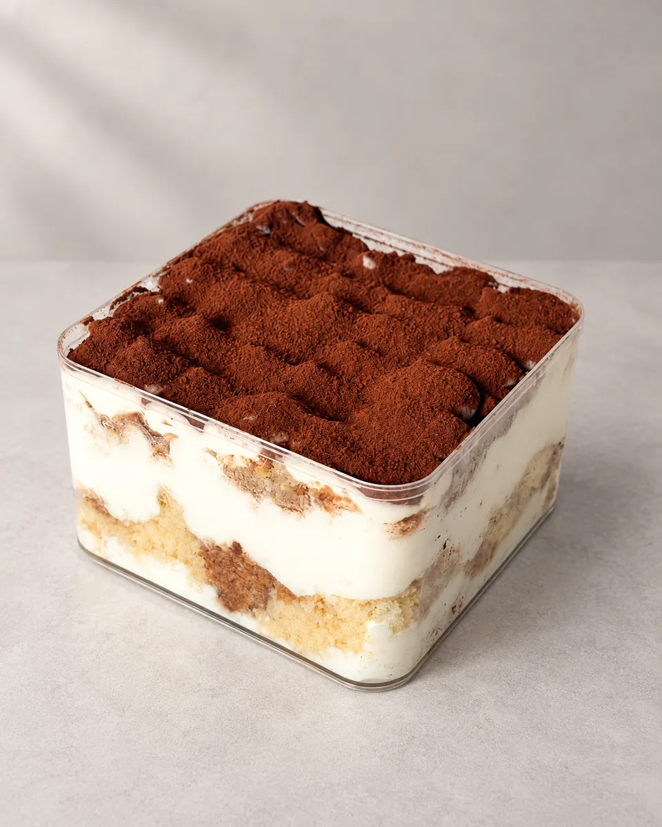 Square jar tiramisu, dusted with cocoa
