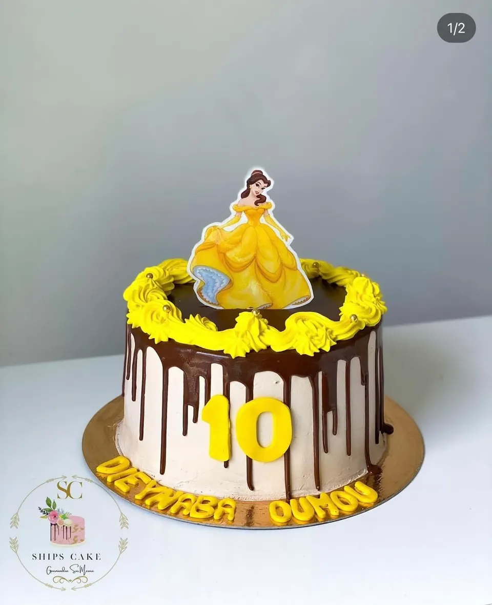 Chocolate drip cake topped with a princess figurine and the number 10