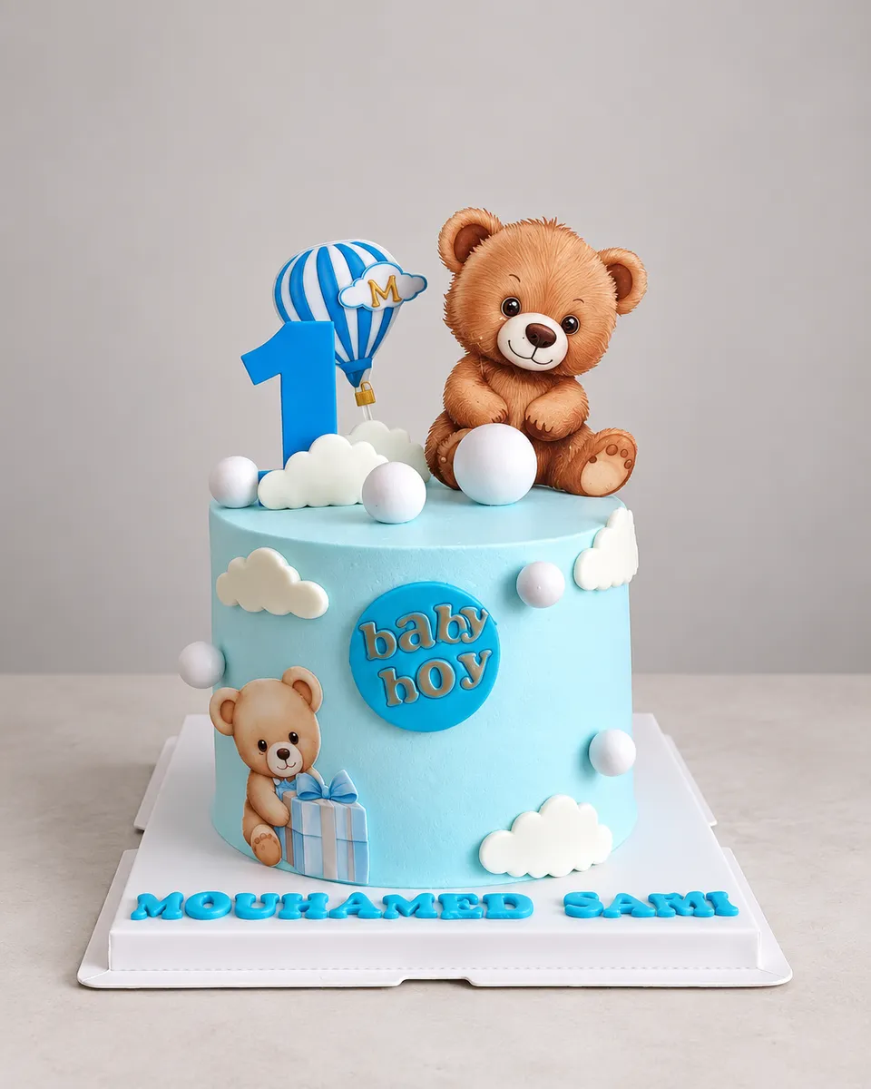 Pale blue cake decorated with a teddy bear, a hot-air balloon and fondant clouds