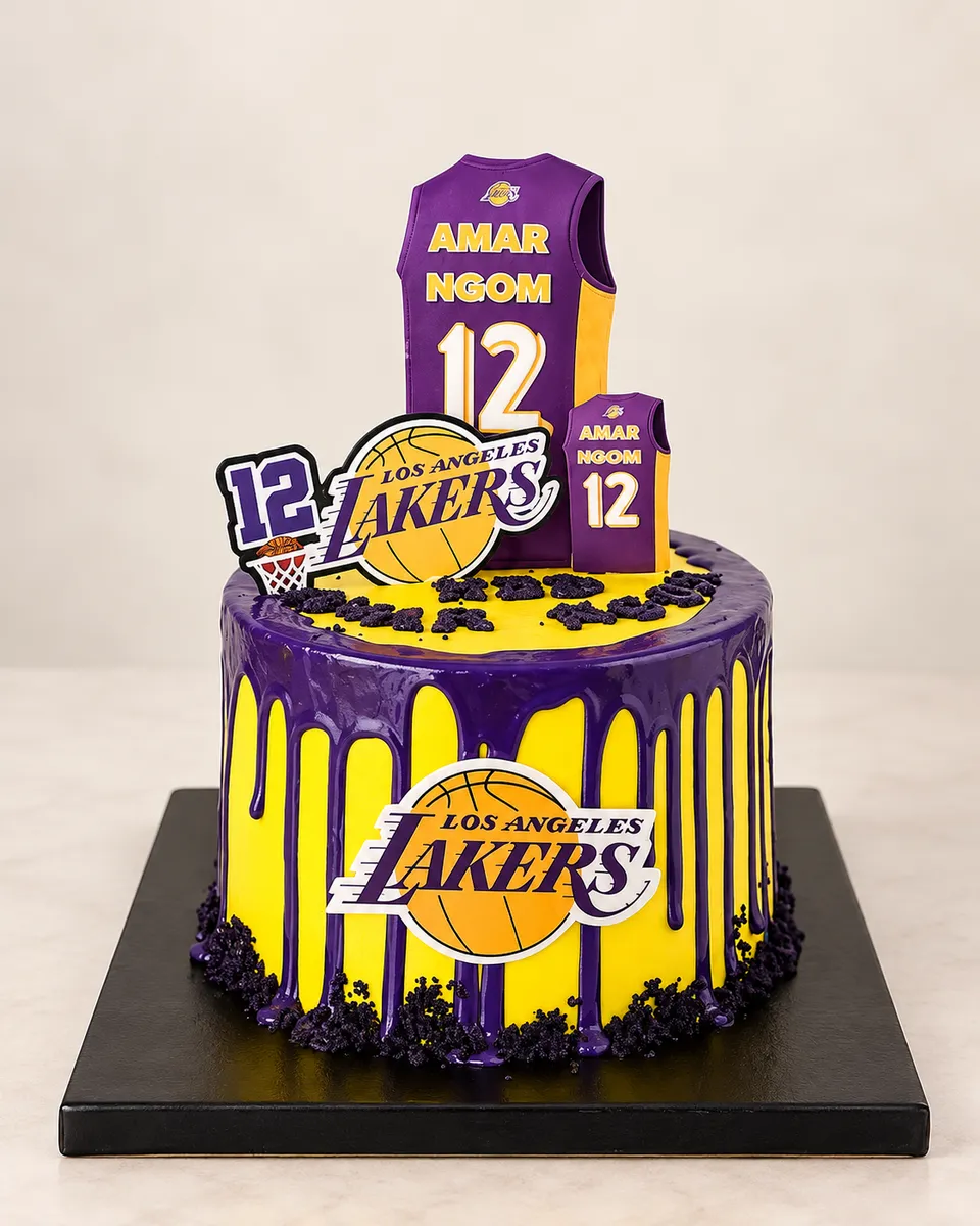 Yellow cake with a purple drip in Los Angeles Lakers colours, with a fondant basketball jersey