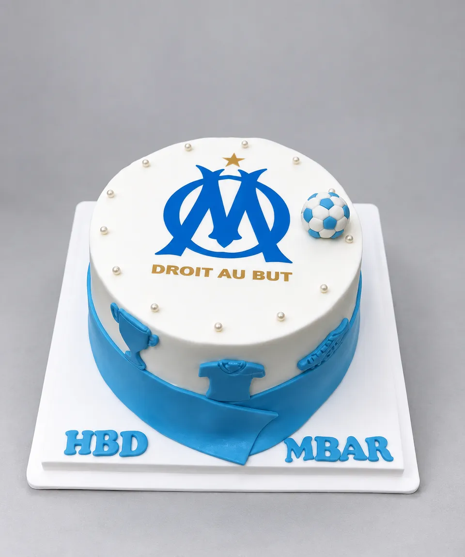 White and blue Olympique de Marseille cake with a fondant football and scarf