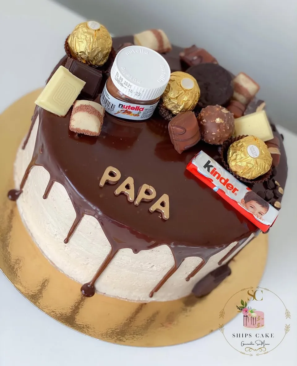 Ganache-topped cake loaded with assorted chocolates and chocolate bars